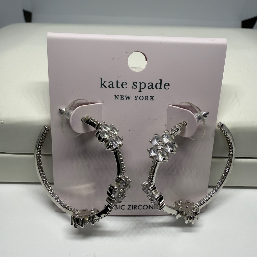 Kate Spade Gleaming Gardenia flower hoops in silver. NEW